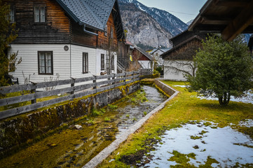 Fototapeta na wymiar Famous Hallstatt mountain village and alpine lake landscape panorama, Austrian Alps, Austria. Landmark with traditional wooden houses. Unesco. Salzkammergut region. Travel and tourism concept