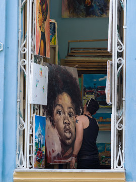 Artist drawing in a studio, Havana, Cuba