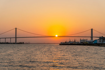 Fototapeta na wymiar Sunset with The Golden Bridge in Maputo, Mozambique
