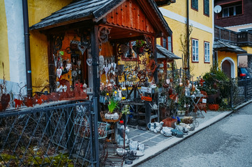 Souvenir shop at the historic area of the mountain village Hallstatt with traditional colorful wooden houses in Halshtati. Austria. Unesco. Salzkammergut region.