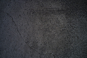 abstract textured dark gray or black surface texture rough background, cement concrete floor or wall