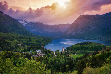 Aerial view of Bohinj lake in Julian Alps. Breathtaking view of the famous Bohinj lake from above. Beautiful view of the Triglav national park and the church of St John the Baptist. Slovenia, Europe