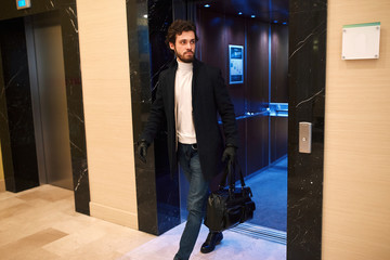 terrorist commiting a crime , full length photo. man coming to work , working day