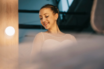 Elegant ballerina in white dress dancing in studio © BGStock72
