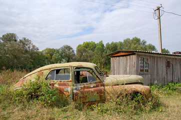 Old abandoned rustic car