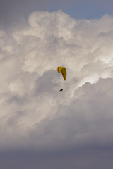 powerful and active white cumulonimbus cloud in a deep blue sky