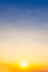 Dramadic Sunset Sky blue and orange light of the sun through the clouds