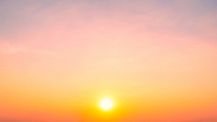 Sky blue and orange light of the sun through the clouds in the sky