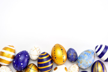 Happy Easter. Frame for text made of easter eggs trendy colored classic blue, white and golden on...