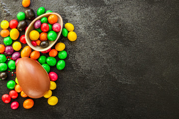 chocolate egg and candy Happy  easter decor. menu concept background. top view. copy space