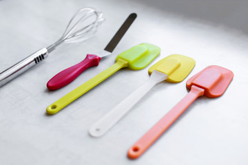 Set of multi-colored silicone spatulas, kitchen tools. Sweet pastries, recipes, cooking