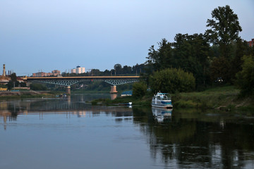 Fototapeta na wymiar View of the wide Neman river over the bridge in the evening.