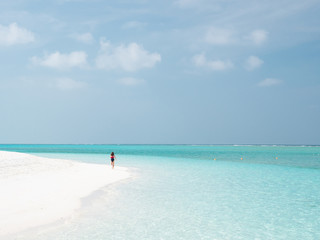 Fototapeta na wymiar Beautiful Young Woman Run on the Maldivian Beach.