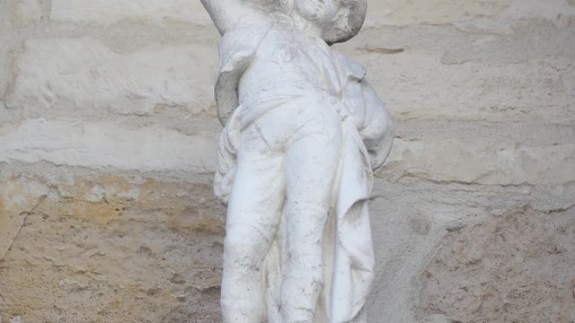 Cinematic view of Marble white traditional ancient french statue in front of Mansle,  France, 6.3.2020