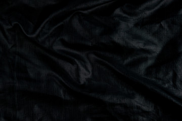 Black abstract background cloth and luxury liquid waves  silk texture satin material