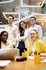 young group of people looking at the camera. designers who creat gorgeous projects. close up vertical shot