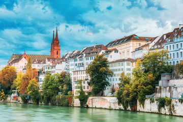Basel, Switzerland. View over Rhine river at Basel Minster Gothic Cathedral during amazing sunset....