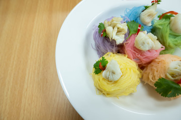 Multicolored rice noodles with crab