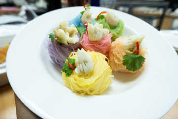 Multicolored rice noodles with crab