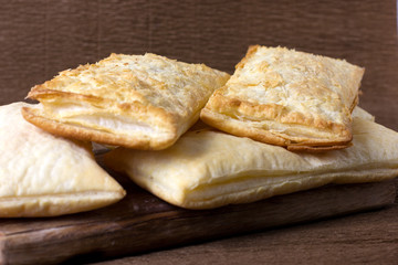 Closeup puff pastry cakes with crispy crust
