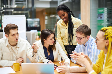 young attractive people developing new stategies at the meeting. young designers making decision. close up photo