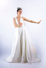 Fototapeta premium Legible bride gesturing stop with her hand isolated on gray background