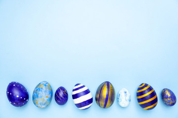 Happy Easter. Frame for text made of easter eggs trendy colored classic blue, white and golden on...
