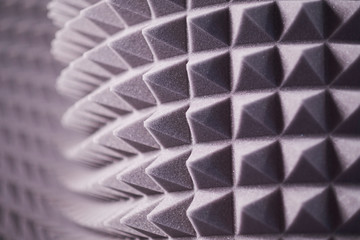 The pattern of the soundproof panel of polyurethane foam. black geometric background