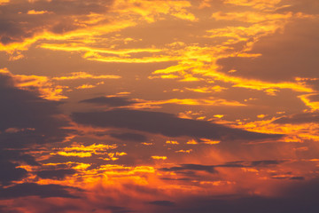 Fototapeta premium beautiful yellow sunrise among the clouds