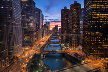 Downtown city buildings and skyline over the Chicago River Illinois USA
