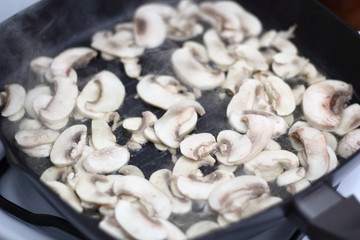 Frying champignon mushroom