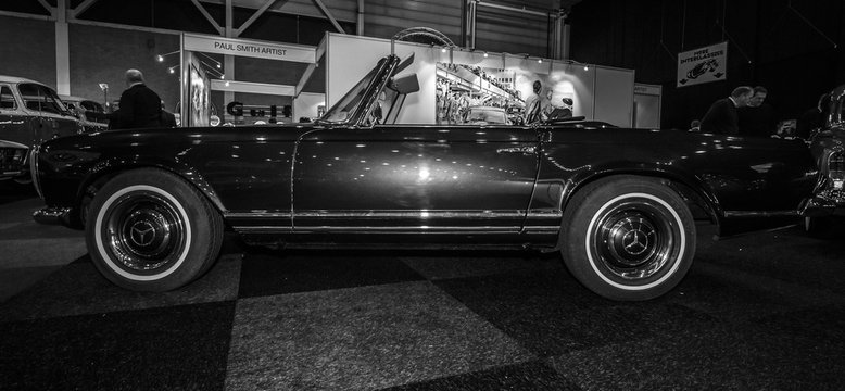 MAASTRICHT, NETHERLANDS - JANUARY 08, 2015: Car Mercedes-Benz 280SL (W113). Black and white. International Exhibition InterClassics & Topmobiel 2015