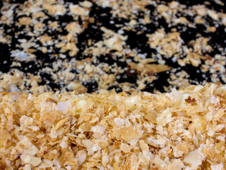 baked puff pastry Napoleon cake on a black background