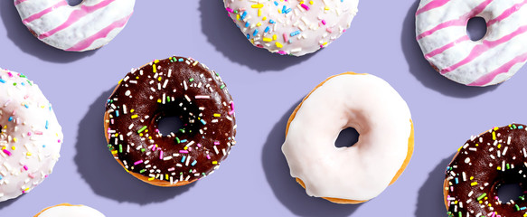 Collection of delicious donuts overhead view flat lay