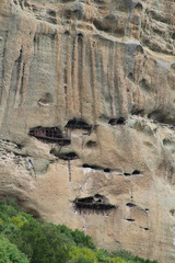 Hermit caves in rock face of Meteora range (Kastraki, Greece)