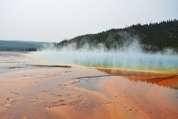 Steam above colorful lake - Yellowstone National Park
