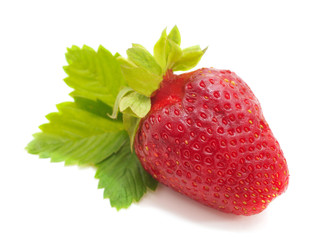 Ripe strawberry with leaves.