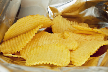 Potato chips in a snack aluminium foil bag or silver package