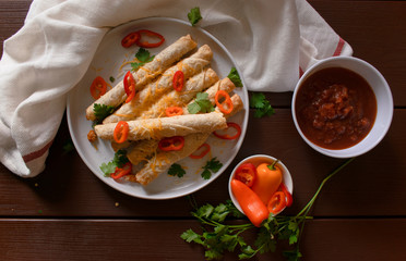 Cheese and chicken taquitos with jalapeño