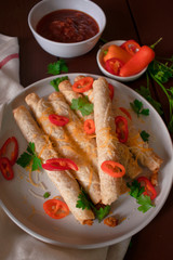 Cheese and chicken taquitos with jalapeño
