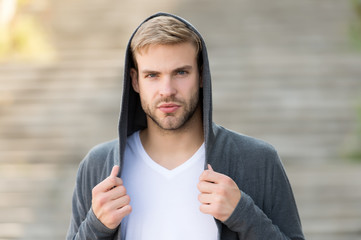 Perfect male. Fashionable young model man. man posing with hoodie. young street man with hood....