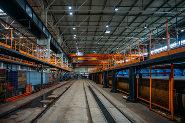 Large hall of warehouse with railroad for freight train load