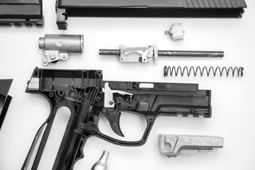 Dismantling a gas gun top view, on a white background