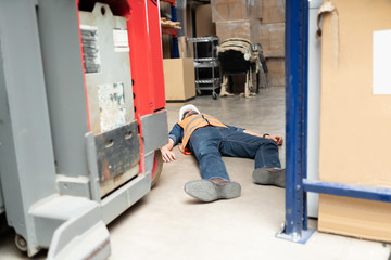 Unconscious Supervisor On Floor At Factory