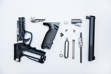 disassembled gun parts, equipment repair