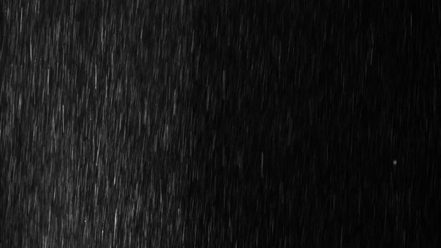 Droplets of rain, falling heavily on one side on an isolated background 