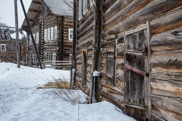 Fototapeta na wymiar Russian traditional wooden peasant houses. Kizhma village, Mezen district, Arkhangelsk region, Russia