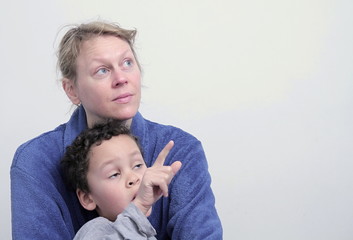 mother and child looking up with white background stock photo 