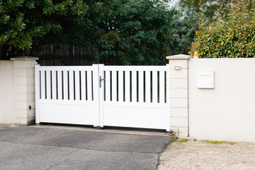 modern gate in white aluminum with blades of suburbs house