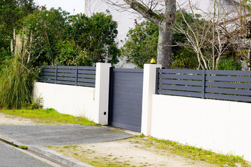 gray suburb metal aluminum house gate and slats